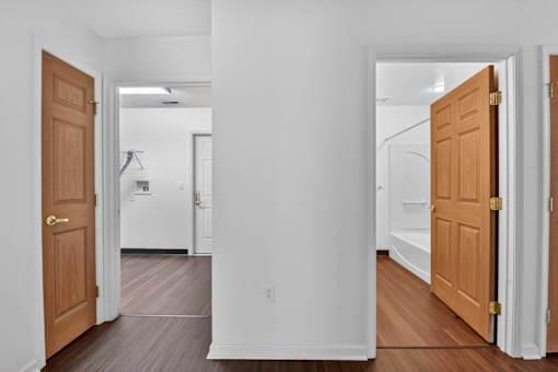 A hallway with two doors on either side.