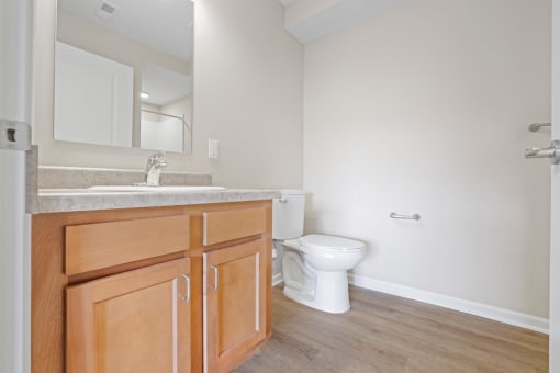a bathroom with a toilet and a wall with the wordruprup on it
