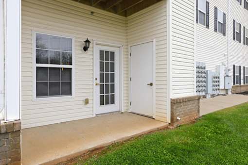 A white door with a window above it on a house.
