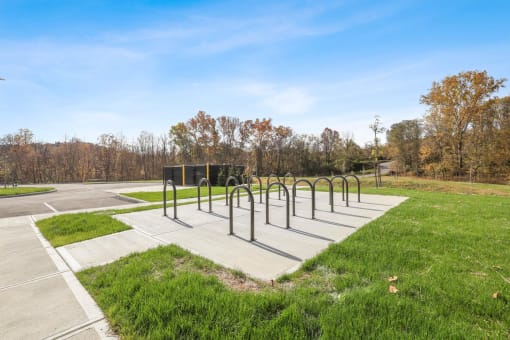 a row of metal racks in a park
