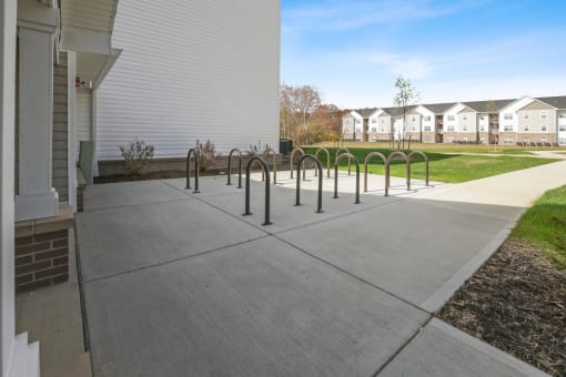 a row of black poles in front of a building