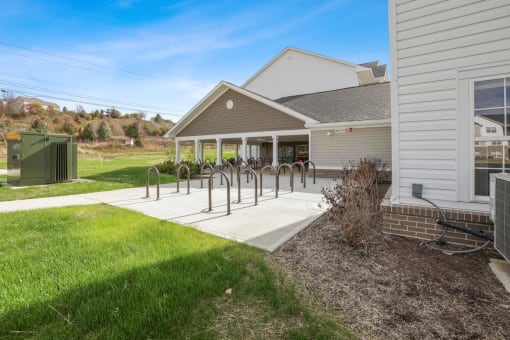 the front of a house with a ramp to the front yard