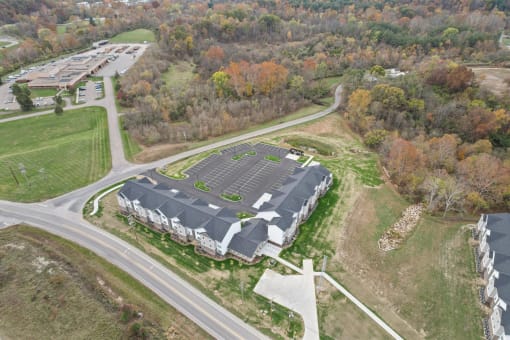 an aerial view of a building with solar panels on the roof
