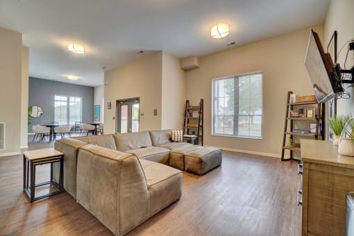 a large living room with a couch and a coffee table
