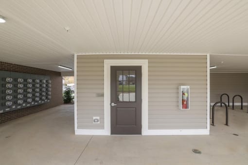 the front door of a home with a porch