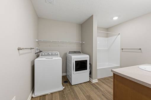 A laundry room with a washer and dryer.