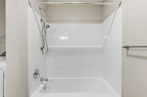 A white bathroom with a shower stall.