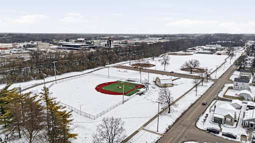 A snow-covered field with a red diamond-shaped area in the center.
