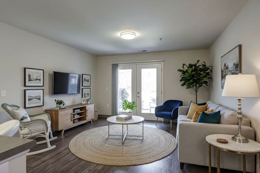 A living room with a sofa, chair, and a coffee table.