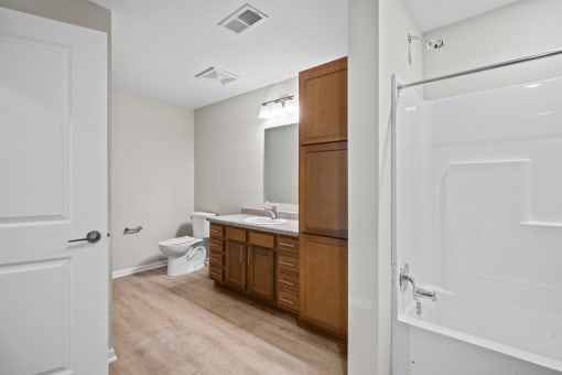 a bathroom with a toilet and a sink and a mirror