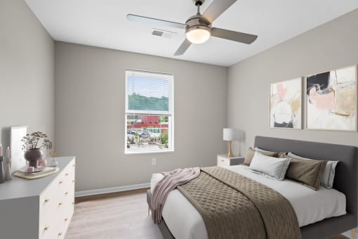 a bedroom with a bed and a ceiling fan