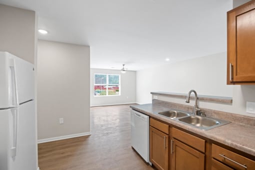 a kitchen with a sink and a refrigerator