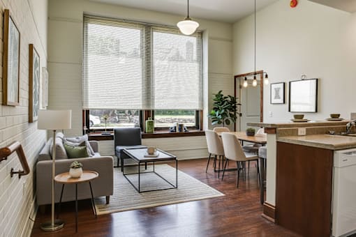 A modern kitchen with a dining table and chairs.