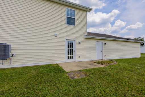 A house with a white door and a window.