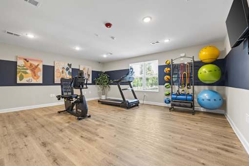 A home gym with a variety of exercise equipment.