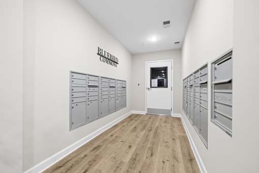 A hallway with a sign that says Bluebird on the wall.