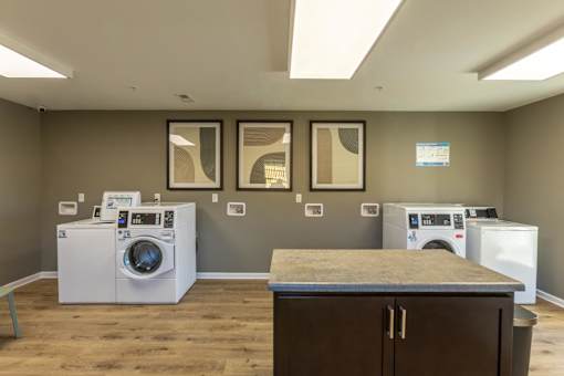 A laundry room with a washer and dryer in it.