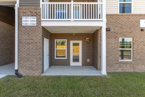 The image shows a building with a sign that reads 1101-1104, 1201-1204, and 1301-1304.