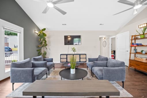 a living room with couches and a coffee table