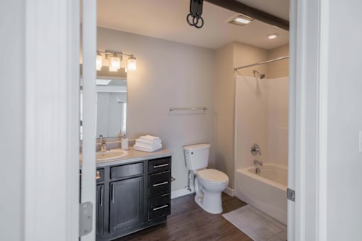 A bathroom with a white toilet and a white sink.