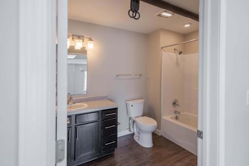 A bathroom with a white toilet and a white sink.