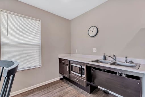 a kitchen with a sink and a window