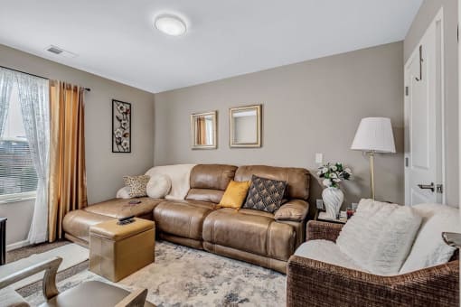 a living room with a couch and a chair