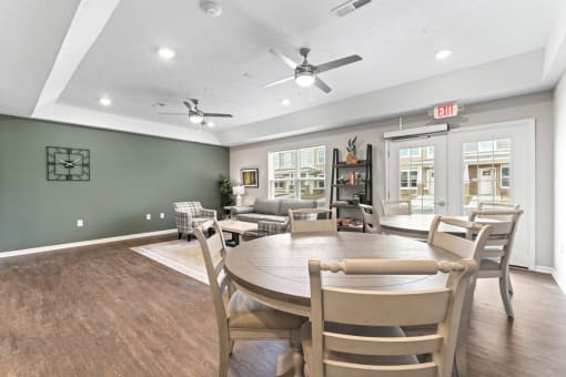 a dining room and living room with a table and chairs