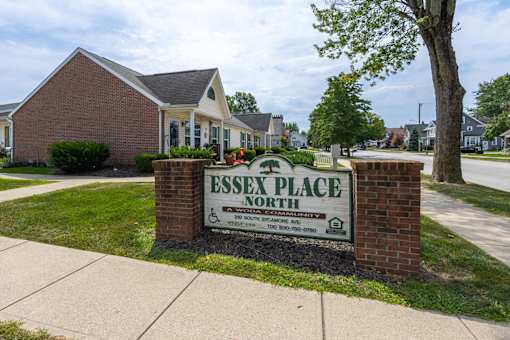 A sign for Essex Place North in front of some houses.