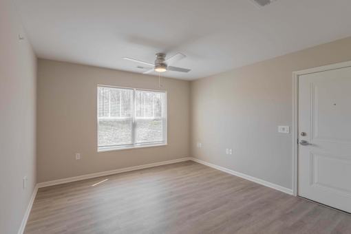 A room with a window and a door.