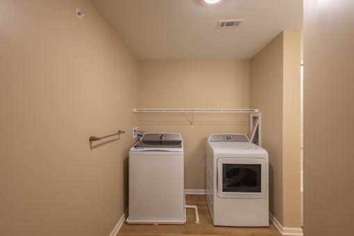 A laundry room with a washer and dryer.