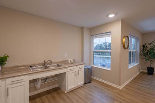 A kitchen with a window and a sink.