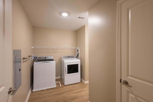A laundry room with a washer and dryer.