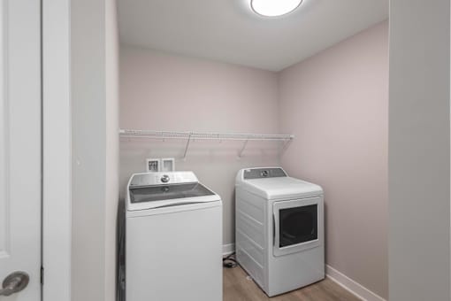 A laundry room with a washer and dryer.