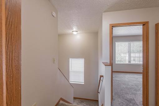 A room with a staircase leading to the second floor.