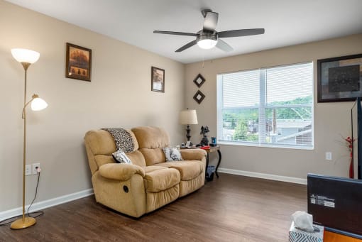 a living room with a couch and a large window