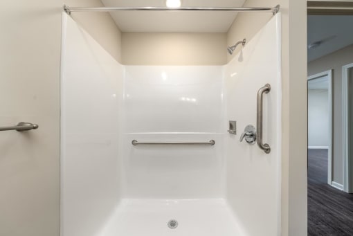 a bathroom with a shower and a sink