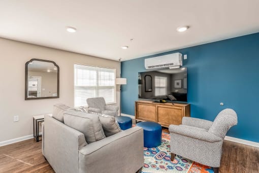a living room with two couches and two chairs