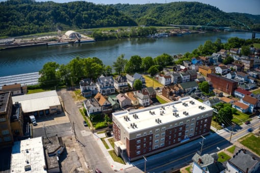arial view of a small town with a river in the background