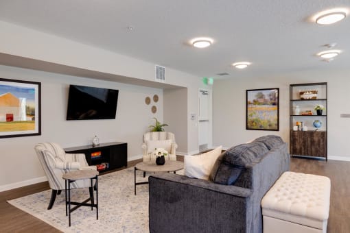 a living room with couches and chairs