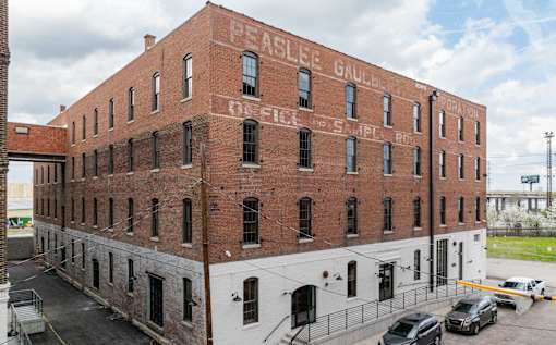 Exterior of Painters Row Apartments, a historic brick building in downtown Louisville, Kentucky.