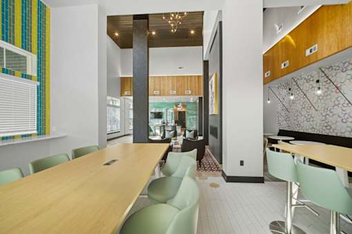 A conference room with a long table and chairs.