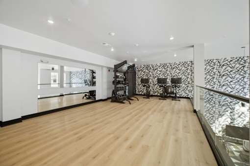A room with wooden floors and a glass railing.