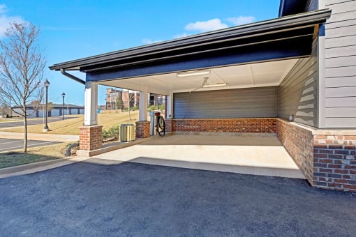 the garage of a home with a covered porch