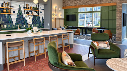 A room with a bar and chairs.