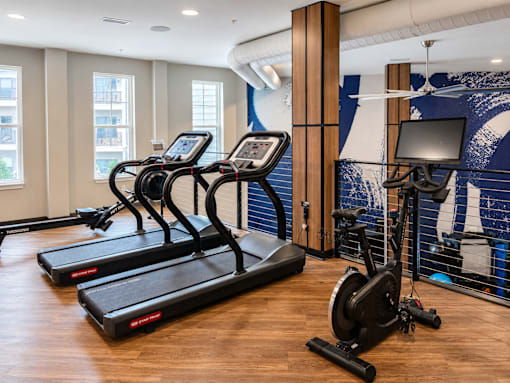 Treadmills, rowing machine and stationary bike in the cardio fitness center at Argento on the Broad in Arden, NC