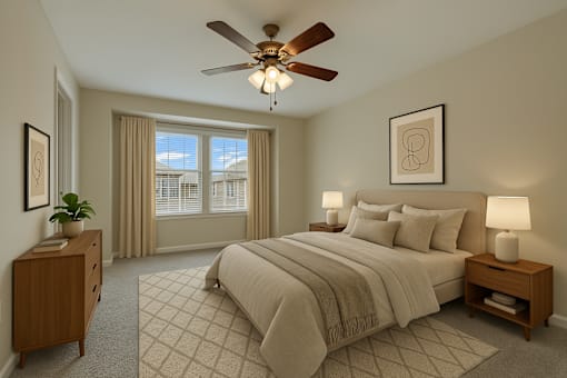 A bedroom with a large bed, a ceiling fan, and a window with curtains.