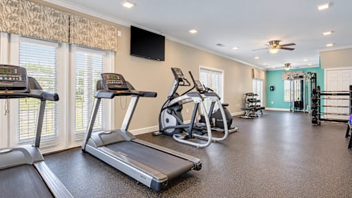 Treadmills, ellipticals and an exercise bike in the fitness center at Canterbury Apartments in Myrtle Beach, SC.