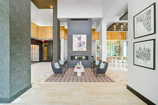 A modern living room with a grey sofa set and a coffee table.