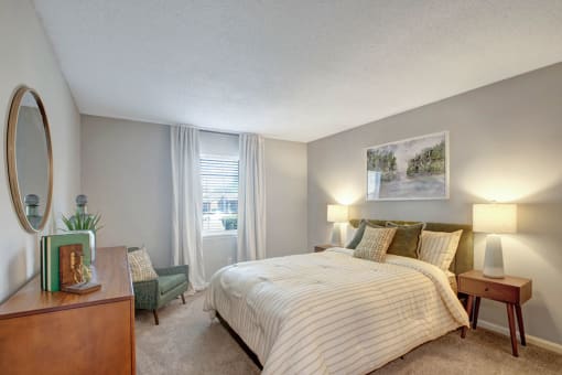 Bedroom, queen size bed, carpet, large window with drapes